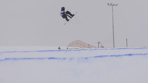 SLOW MOTION: Young Pro Snowboarder Big Air