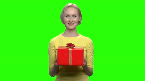 Beautiful Adorable Woman Holding Red Gift Box