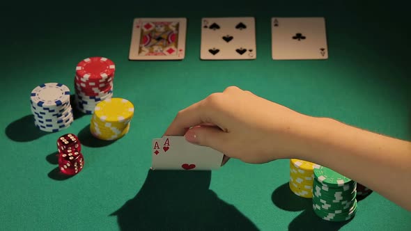 Experienced Gambler Using Risky Bluff Strategy to Win More Money in Poker Game
