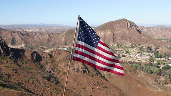 USA Flag on a Flagpole.  Aerial of the American Flag Is Fluttering on a Wind