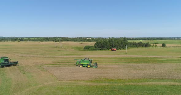 Combine Harvester on Wheat Field