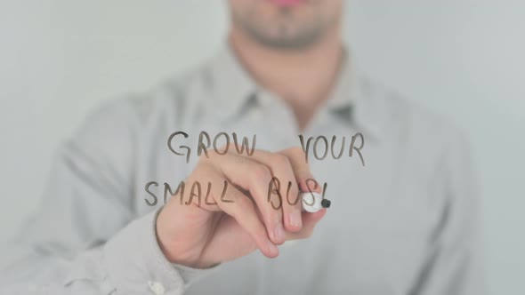 Grow Your Small Business Writing on Screen with Hand