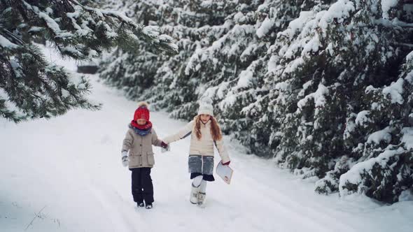 Children with big envelope on natural winter background.