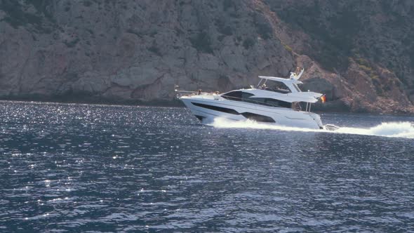 View of Yacht Near Rocky Island of Mallorca or Ibiza