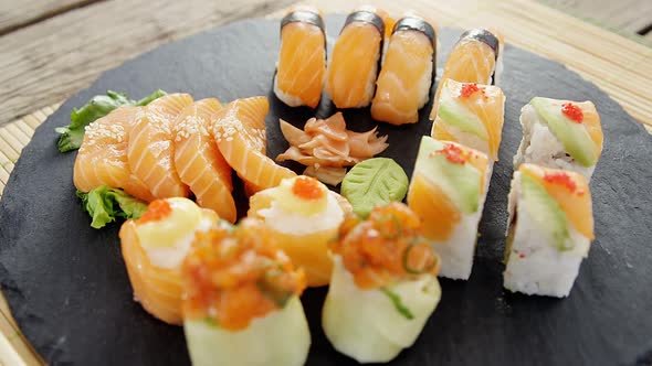 Close-up of various sushi on tray with chopstick