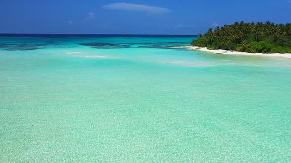 Aerial landscape of perfect lagoon beach break by blue sea with white sand background of a dayout ne