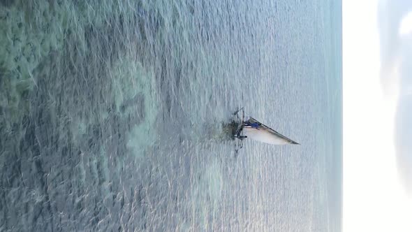 Vertical Video Boats in the Ocean Near the Coast of Zanzibar Tanzania Aerial View