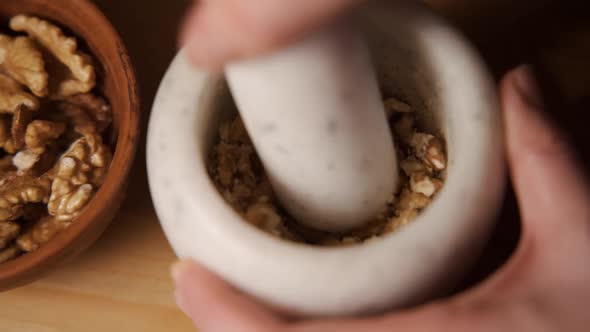 Hand Pounding Spices in Stone Mortar Traditional Thai Curry