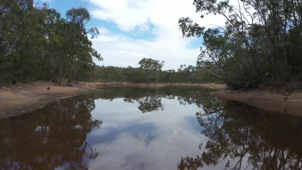 Aerial footage of a drought affected agricultural water reservoir in regional Australia