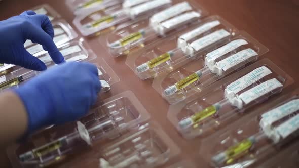 Syringes with the Drug are Packed By Hand