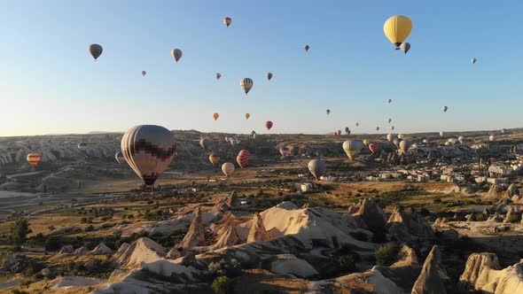 Aerial Hot Air Balloons Flying Over Hoodoos and Fairy Chimneys in Goreme Valley Cappadocia, Turkey