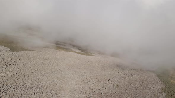 Scenic aerial view of moving white clouds at Abuli Mountain. Georgia