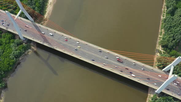 Modern cable stayed bridge and car traffic on background. Highway traffic jam. Aerial View