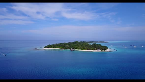 Aerial view scenery of exotic shore beach journey by aqua blue ocean and white sandy background of a