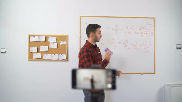 Young Male Math Teacher Doing Online Classes Live Streaming To the Class During Quarantine