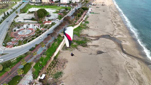 Aerial view 4 K parachute jumper flying over beautiful Alanya