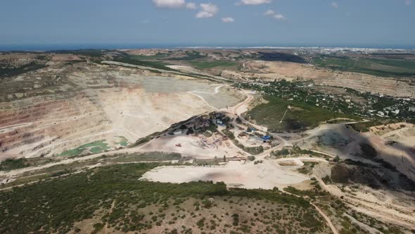 Aerial View Industrial of Opencast Mining Quarry with Lots of Machinery at Work Extracting Fluxes