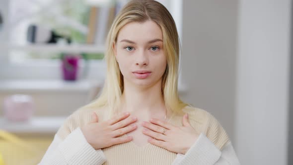 Portrait of Positive Young Disabled Deaf Woman Showing I Love you Gesture in Sign Language and