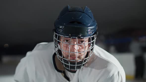 Slow Motion Portrait of a Forward Hockey Player Seriously Looking at the Camera Steam Coming From