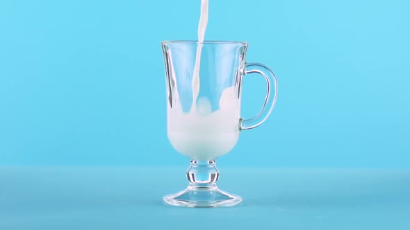 Milk Cold Beverage Drink Pooring Into Latte Glass Mug Blue 