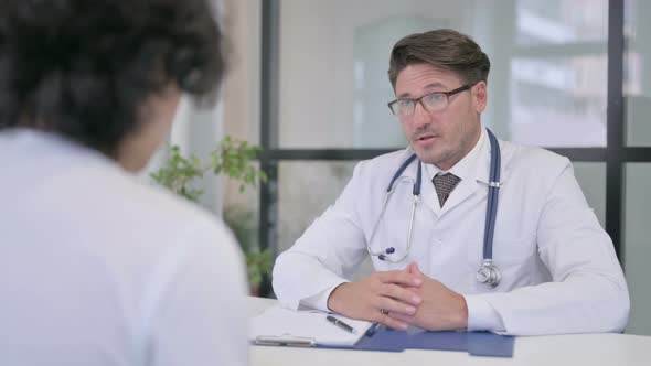 Doctor Talking to Patient in Clinic