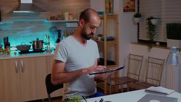 Businessman Using Tablet Pc While Working Remotely