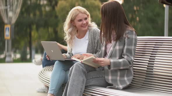 Students Outdoors Study Together Women Book Street