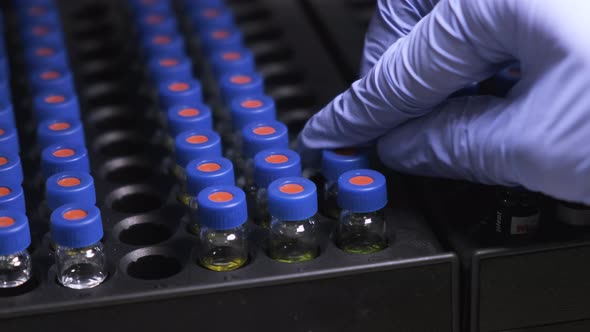 Scientist Puts Samples Into Auto Sampler for HPLC Analysis