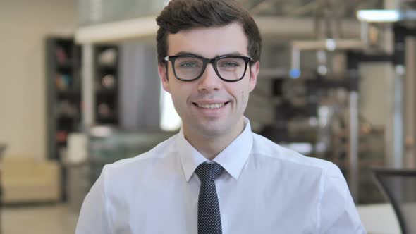 Smiling Businessman in Office