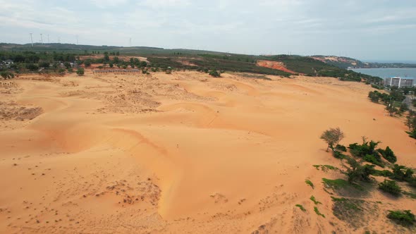 aerial circling a red sand dune desert landscape in Mui Ne Vietnam