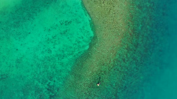 Beautiful aerial abstract shot of a summer white paradise sand beach and blue ocean background in 4K