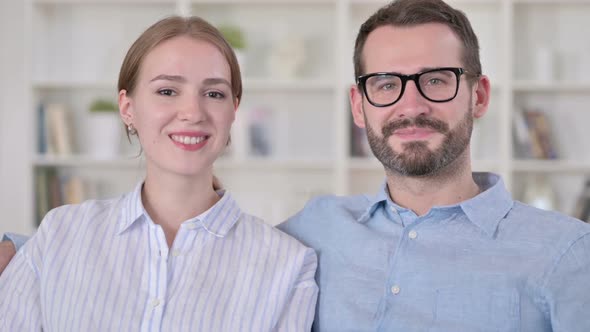 Portrait of Attractive Young Couple Smiling at the Camera