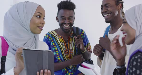 African Students in Traditional Clothes Planing and Preparing for Activity at University