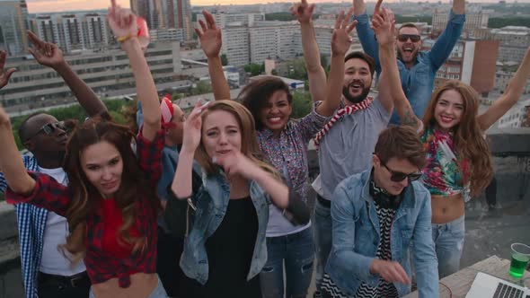Carefree Young People Partying Nonstop on Rooftop