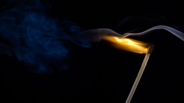 Burning Match on a Black Background in 