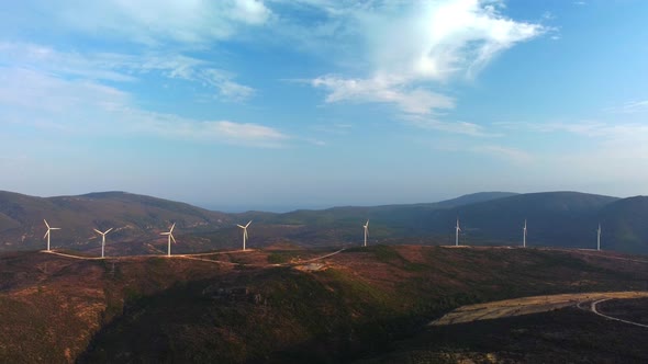 Drone Flies Over a Windmill Park