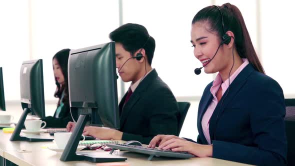 Business People Wearing Headset Working in Office