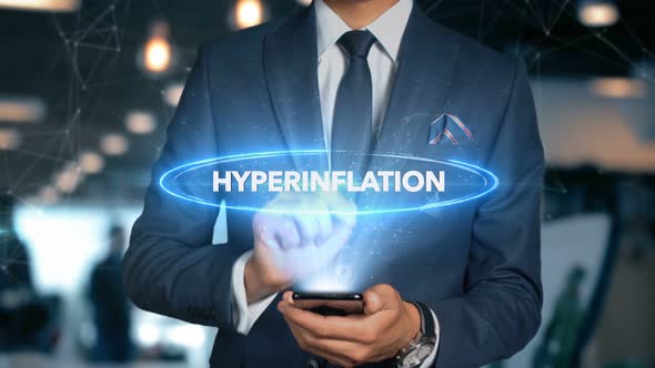 Businessman Smartphone Hologram Word   Hyperinflation