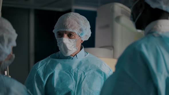 Closeup of the Doctor and Three of His Colleagues in the Operating Room