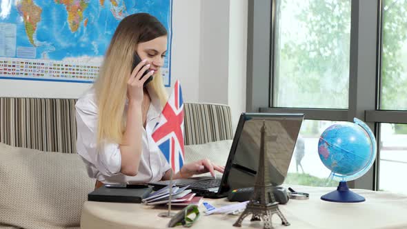 Young Woman Works As a Consultant for a Travel Agency