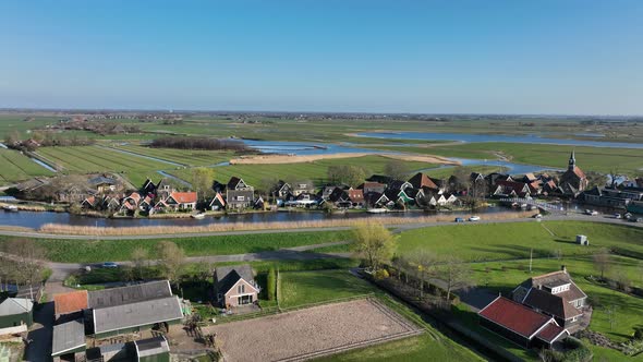 Small Historic Typical Dutch Polder Farm Village in Green Countryside Sunny Spring Landscape with