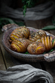 Baked whole potatoes with herbs and spices. Food photography in - PhotoDune Item for Sale