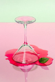 The composition of the inverted glass with a drink on a pastel p - PhotoDune Item for Sale