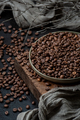Freshly roasted coffee beans on a dark table. Low key photograph - PhotoDune Item for Sale