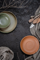 Plates, cutlery and cloth on a dark brown textural background. B - PhotoDune Item for Sale