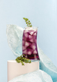 Cold cocktail with ice in a tall glass on a light blue backgroun - PhotoDune Item for Sale