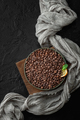 Freshly roasted coffee beans on a dark table. Low key photography flat-lay. - PhotoDune Item for Sale