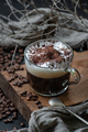 Coffee americano with milk foam and chocolate on a wooden board - PhotoDune Item for Sale