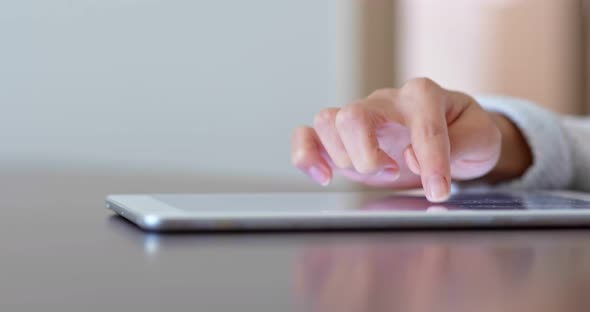Close up of woman finger touch on tablet computer