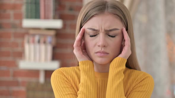 Portrait of Tired Young Woman Having Headache